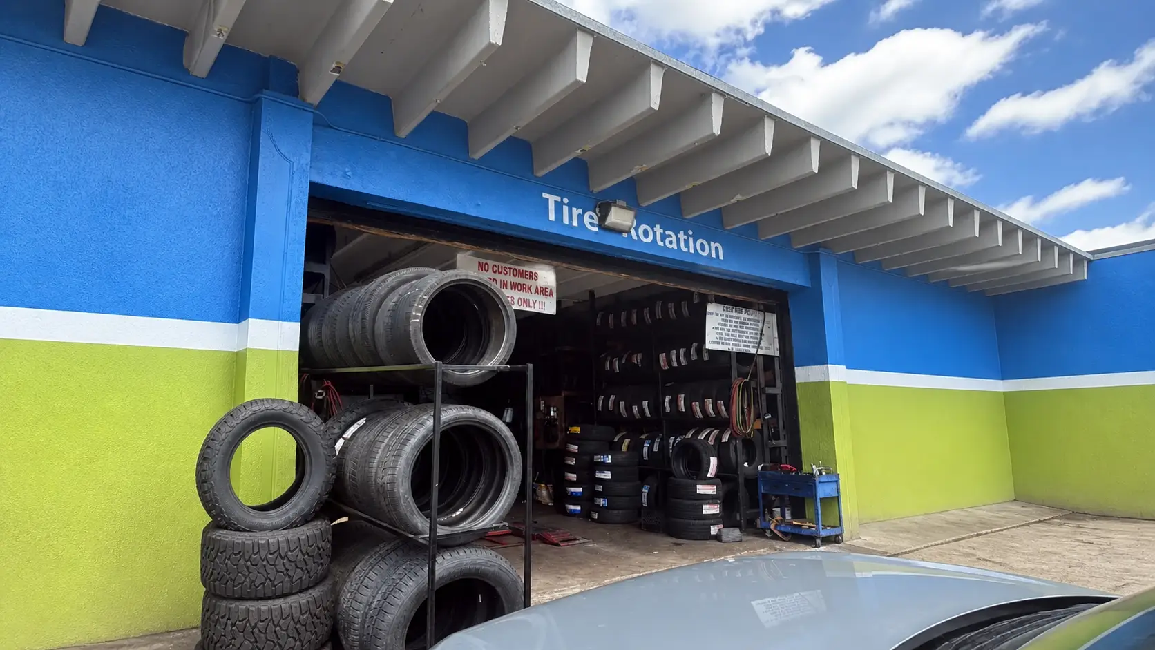 Auto Tire Rivera service bay painted in the shop's blue and green
